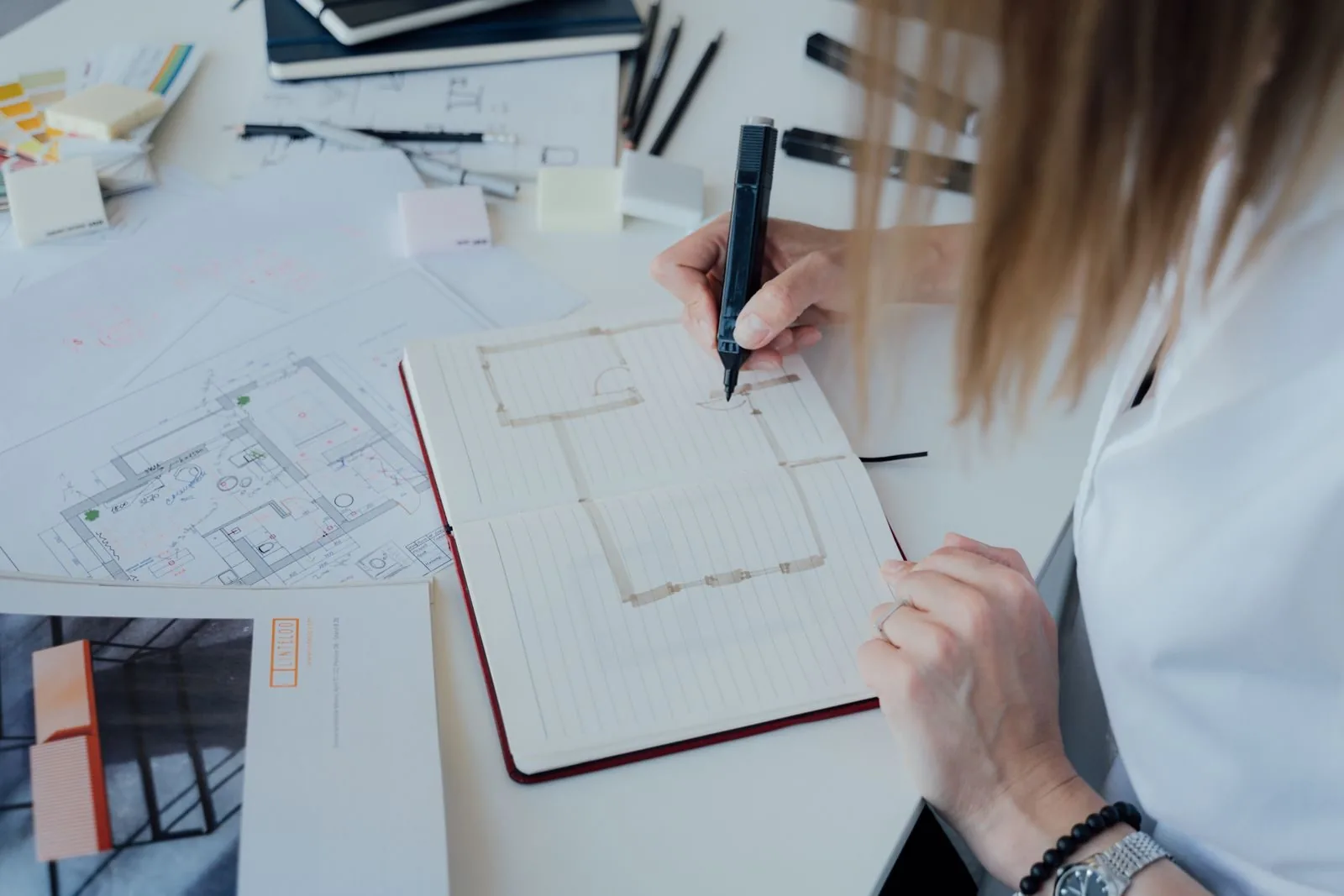 Architect sketching floor plans in an office